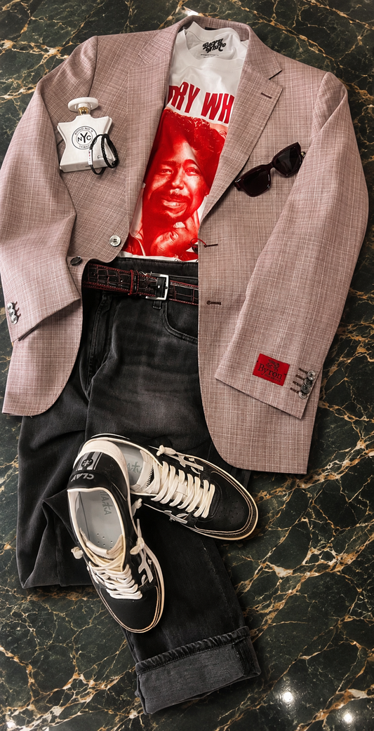 A picture of a sportcoat over a Barry White T-Shirt with black jeans, sunglasses, a bracelet, Tribeca fragrance and Premiata sneakers