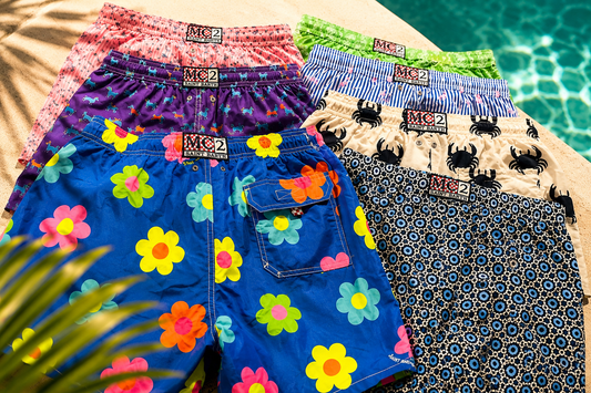 Picture of various MC2 Saint Barth Swimsuits by a pool